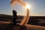 playing with sand on sahara morocco